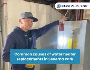 Technician checking an aging water heater during inspection in a Severna Park home